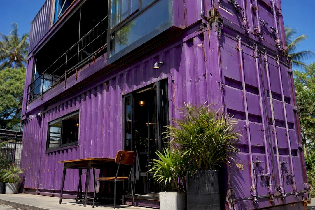 Container cafe with industrial steel siding exterior
