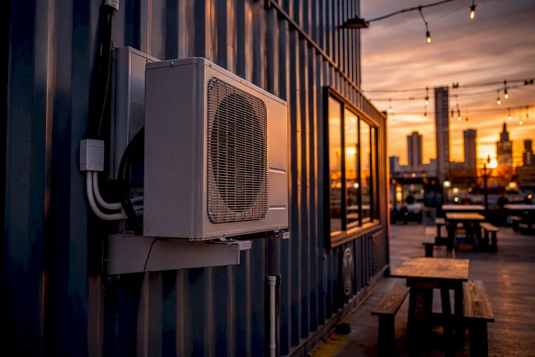 Mini-split heat pump on container cafe exterior