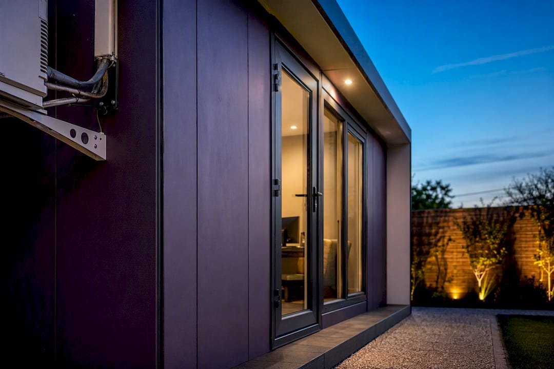 Heat pump installation on garden office exterior